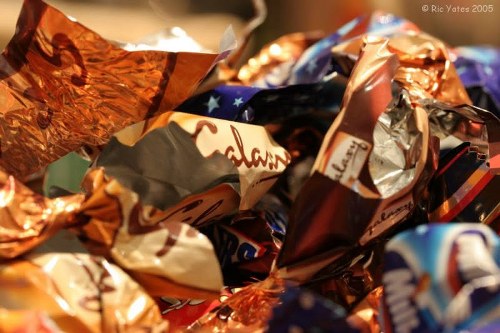 Worker wearing full PPE handling garden waste